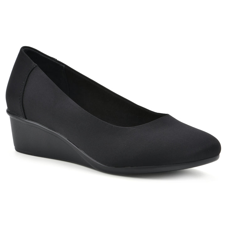 Angle view of a low, black, fabric wedge with black sole