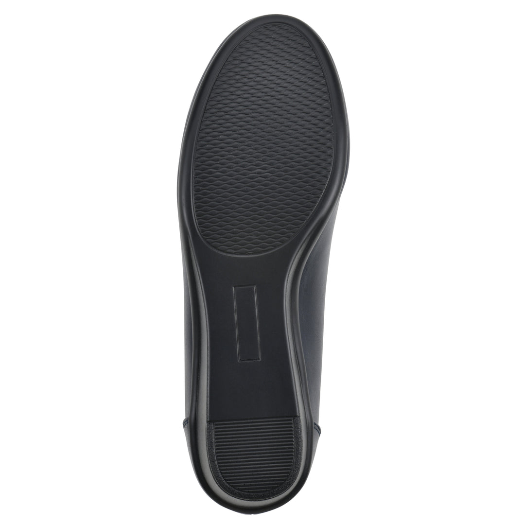 Sole view of a low, navy, faux leather wedge with black sole