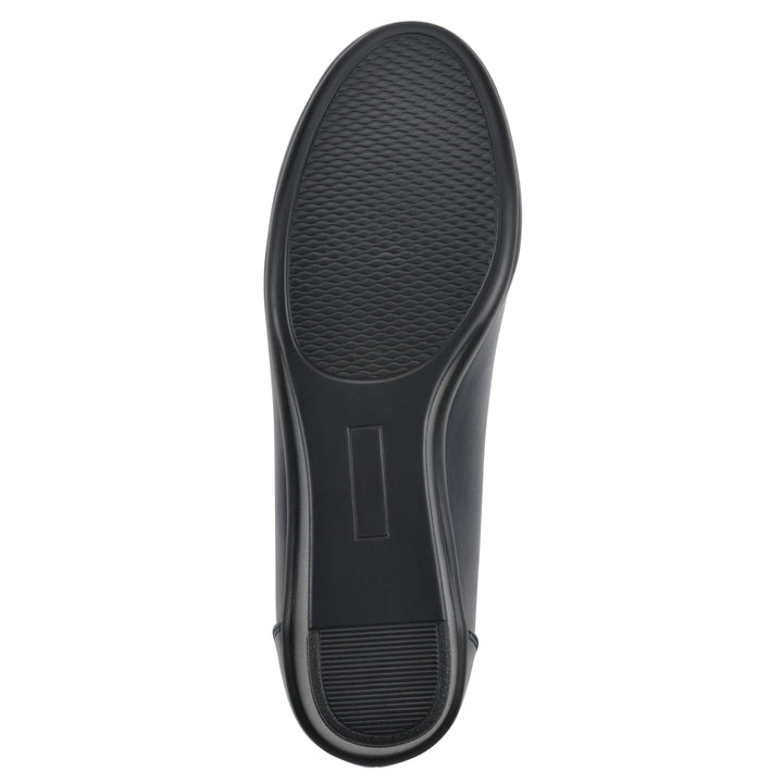 Sole view of a low, navy, faux leather wedge with black sole