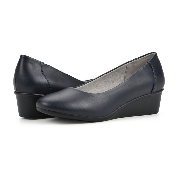 Angle view of a pair of low, navy, faux leather wedge with black sole