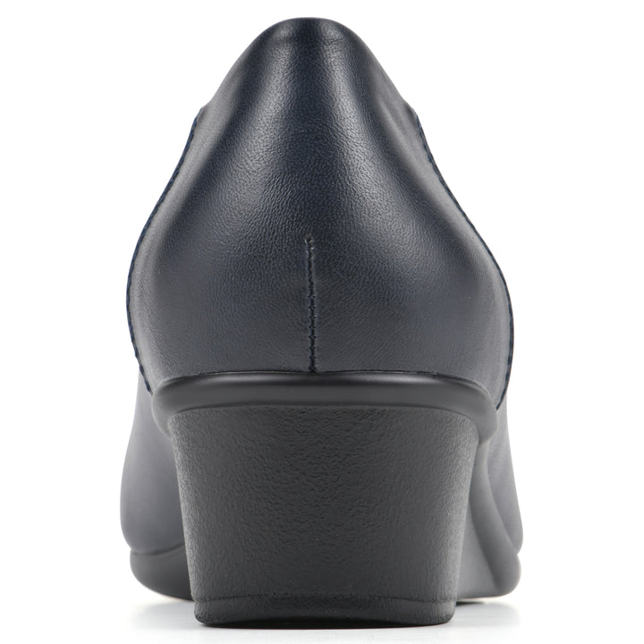 Rear view of a low, navy, faux leather wedge with black sole