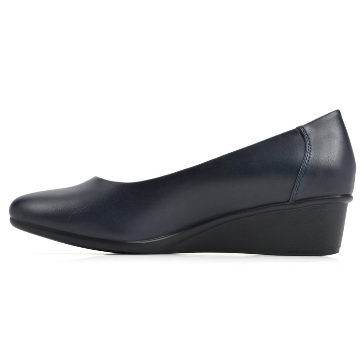 Side view of a low, navy, faux leather wedge with black sole