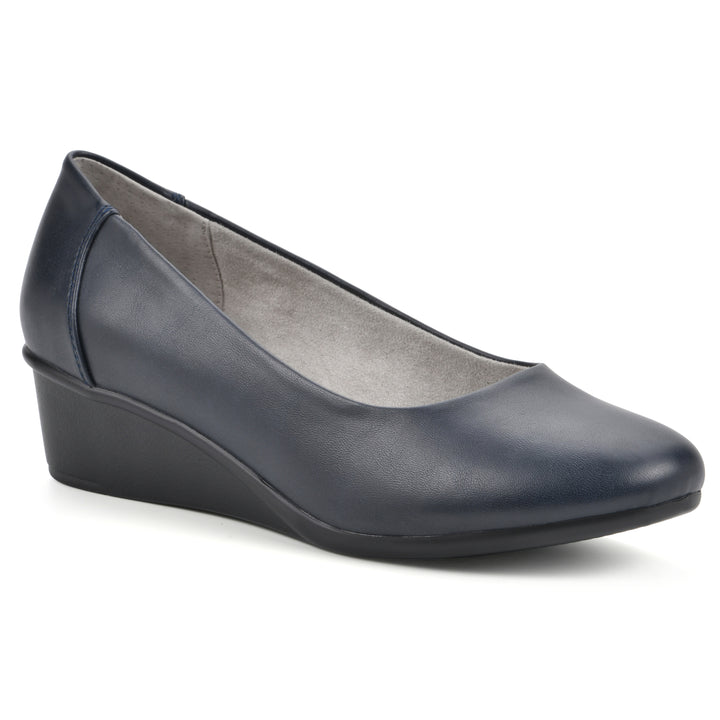Angle view of a low, navy, faux leather wedge with black sole