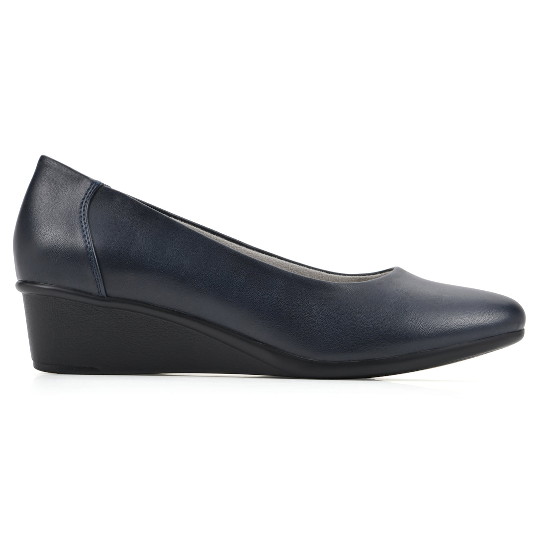 Side view of a low, navy, faux leather wedge with black sole