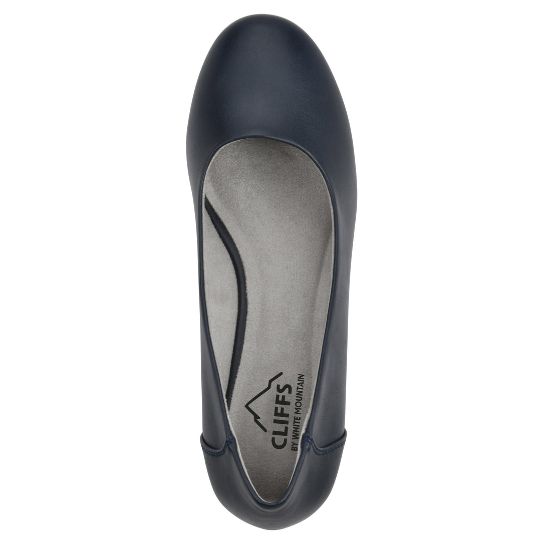 Top view of a low, navy, faux leather wedge with black sole