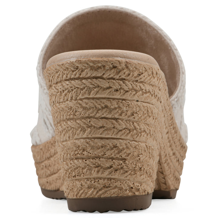 Rear view of an ivory wedge sandal with cream embroidered floral pattern and a braided rope-style sole
