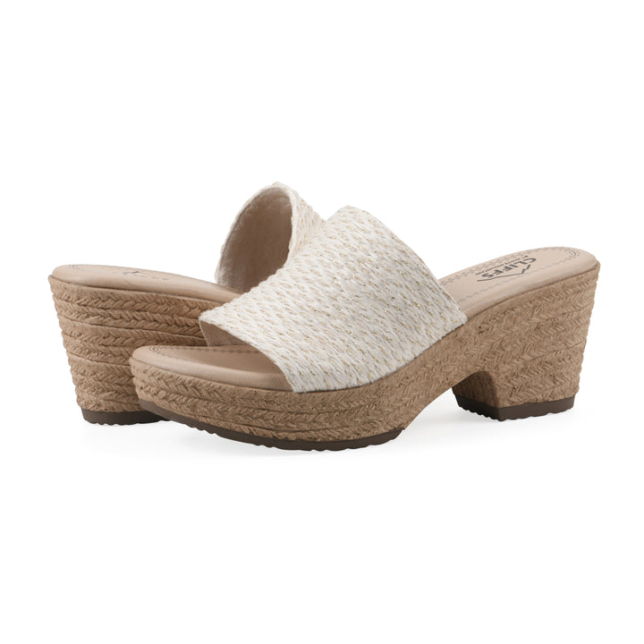 Angle view of a pair of white and gold threaded fabric wedge sandals with a braided rope-style sole