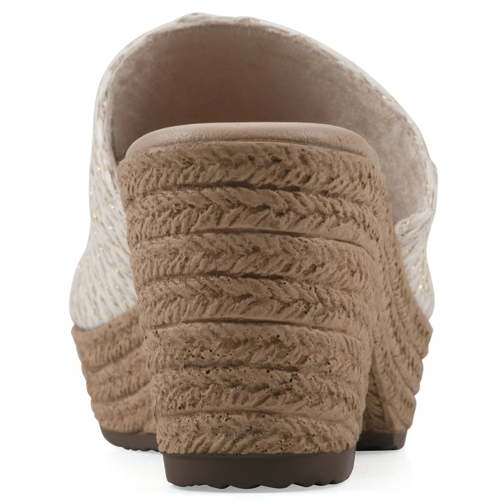 Rear view of a white and gold threaded fabric wedge sandal with a braided rope-style sole