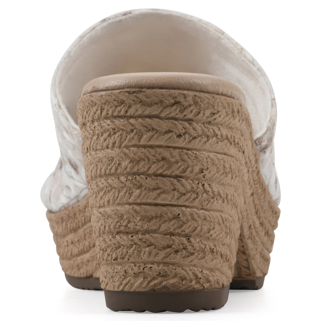 Rear view of a soft white floral designed wedge sandal with a braided rope-style sole