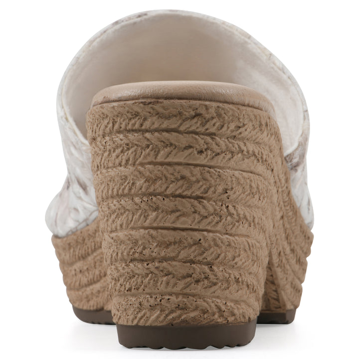 Rear view of a soft white floral designed wedge sandal with a braided rope-style sole