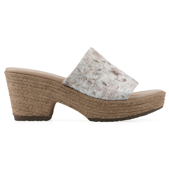 Side view of a soft white floral designed wedge sandal with a braided rope-style sole