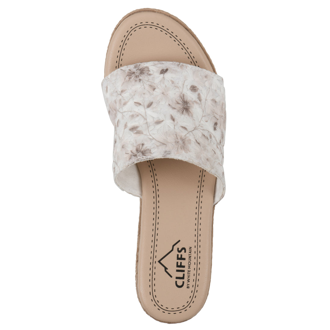 Top view of a soft white floral designed wedge sandal with a braided rope-style sole