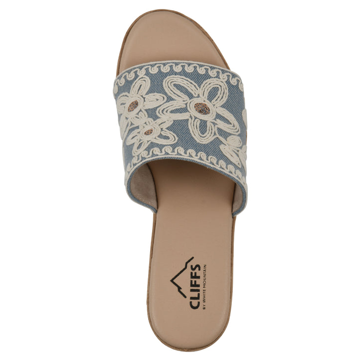 Top view of a denim wedge sandal with cream embroidered floral pattern and a braided rope-style sole