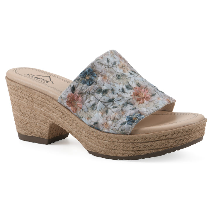Angle view of a muted watercolor floral pattern wedge sandal and a braided rope-style sole
