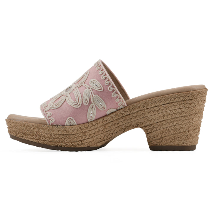 Side view of a pale pink wedge sandal with cream embroidered floral pattern and a braided rope-style sole