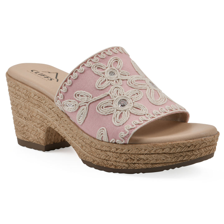 Angle view of a pale pink wedge sandal with cream embroidered floral pattern and a braided rope-style sole