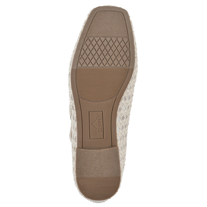 Sole view of an ecru mesh ballet flat with double adjustable mini straps and a brown sole 