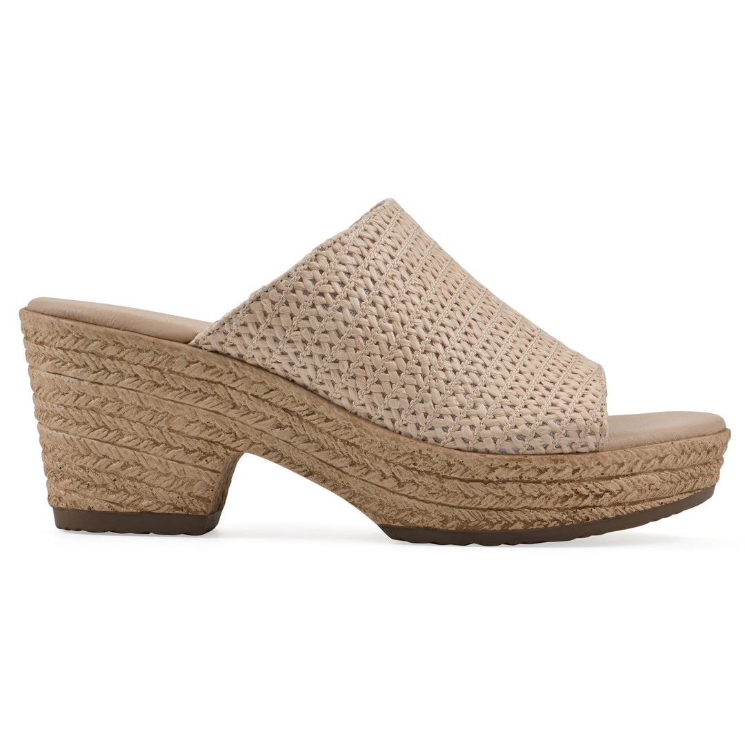 Side view of a natural raffia wedge sandal with a braided rope-style sole