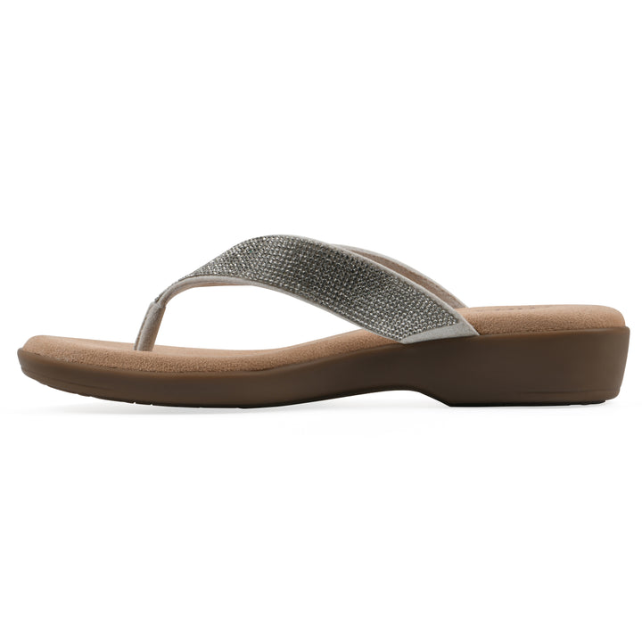 Side view of a cushioned thong sandal with low-sheen textured ecru straps and a tan sole 