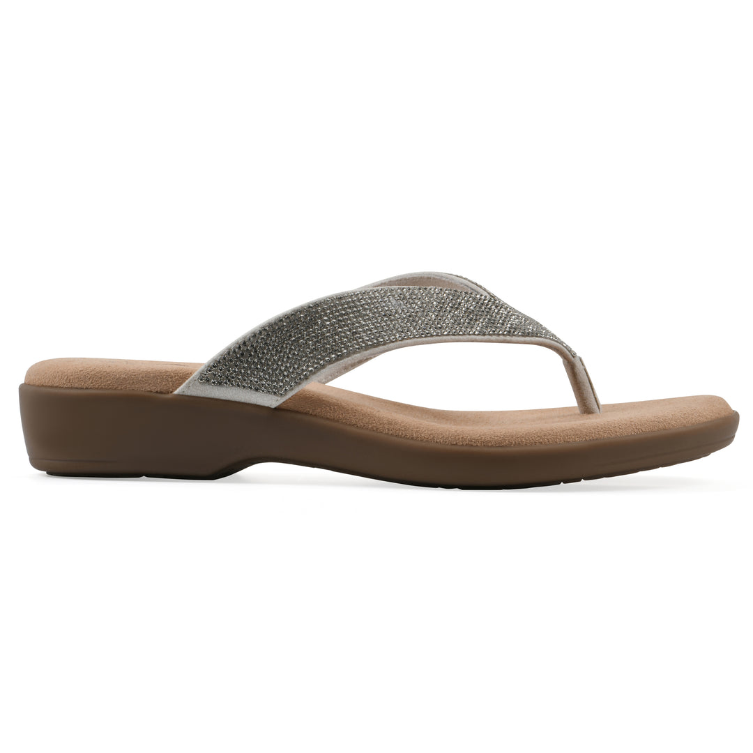 Side view of a cushioned thong sandal with low-sheen textured ecru straps and a tan sole 