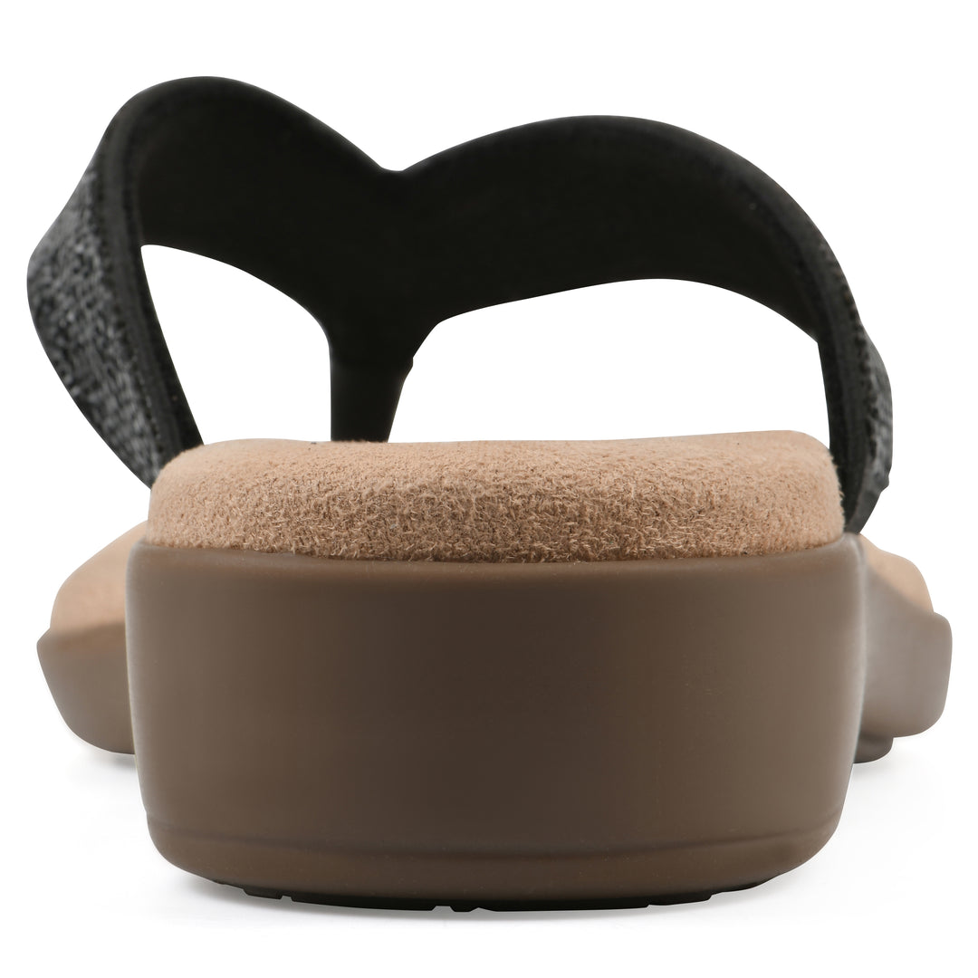Rear view of a cushioned thong sandal with low-sheen textured black straps and a tan sole 