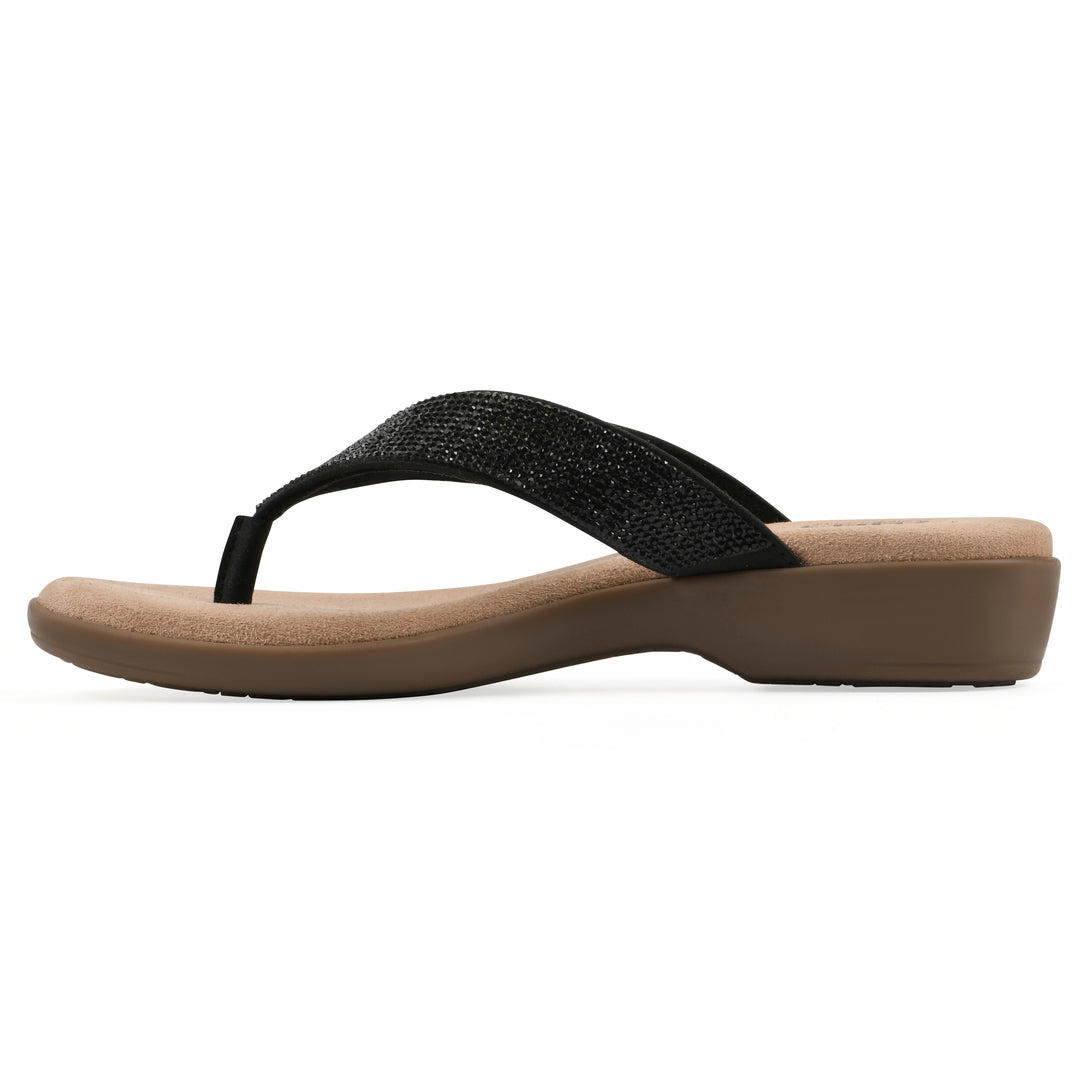 Side view of a cushioned thong sandal with low-sheen textured black straps and a tan sole 