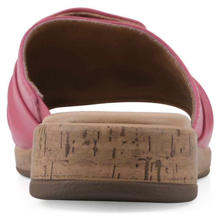Rear view of a mauve faux leather sandal with centered twist, and cork-print sole design