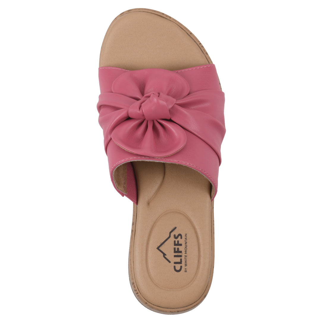Top view of a mauve faux leather sandal with centered twist, and cork-print sole design