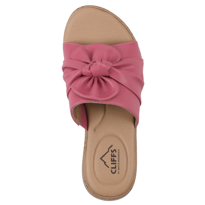 Top view of a mauve faux leather sandal with centered twist, and cork-print sole design