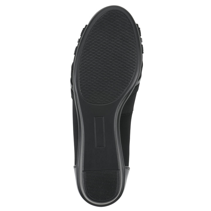 Sole view of slip-on black wedge with a peep toe