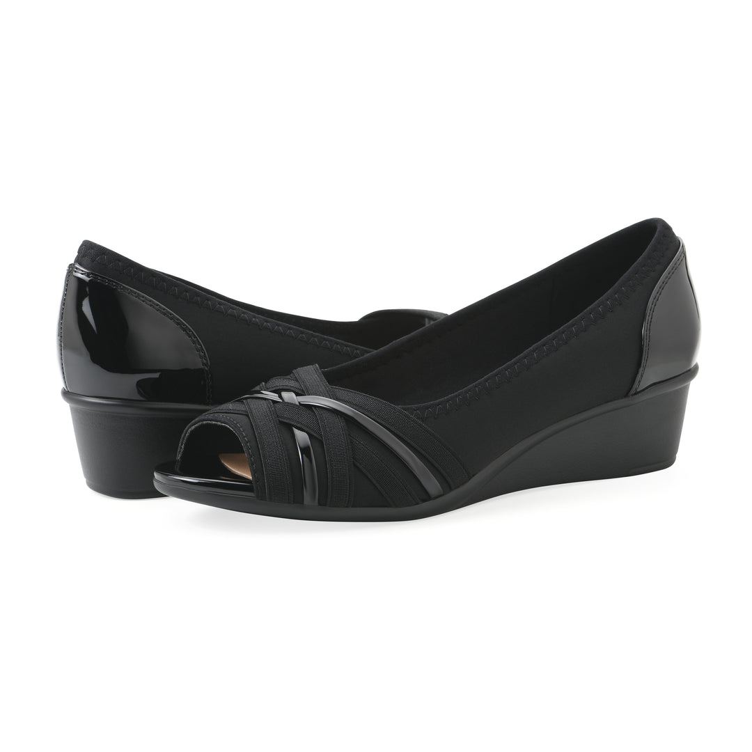 Angle view of a pair of slip-on black wedges with a peep toe