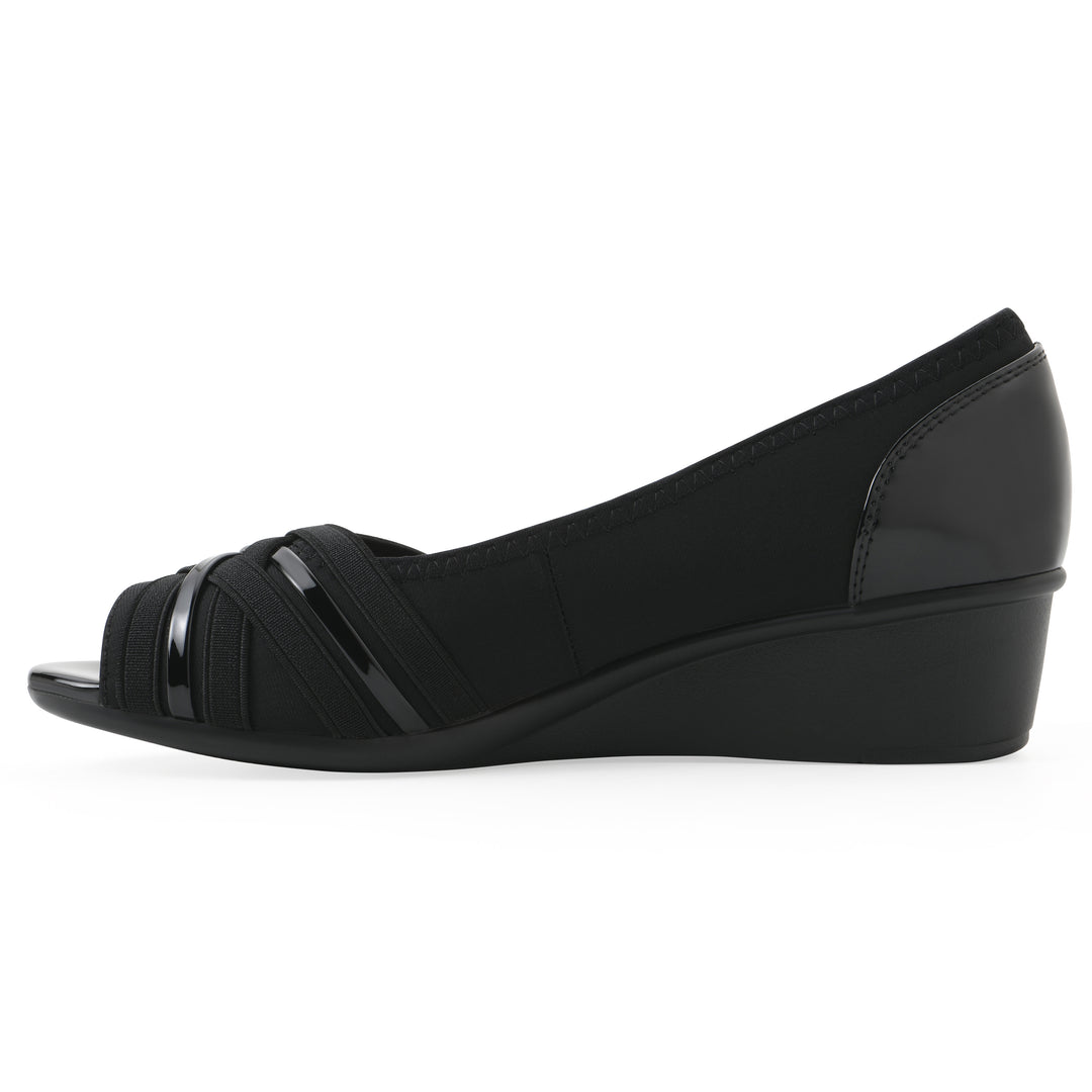 Side view of slip-on black wedge with a peep toe