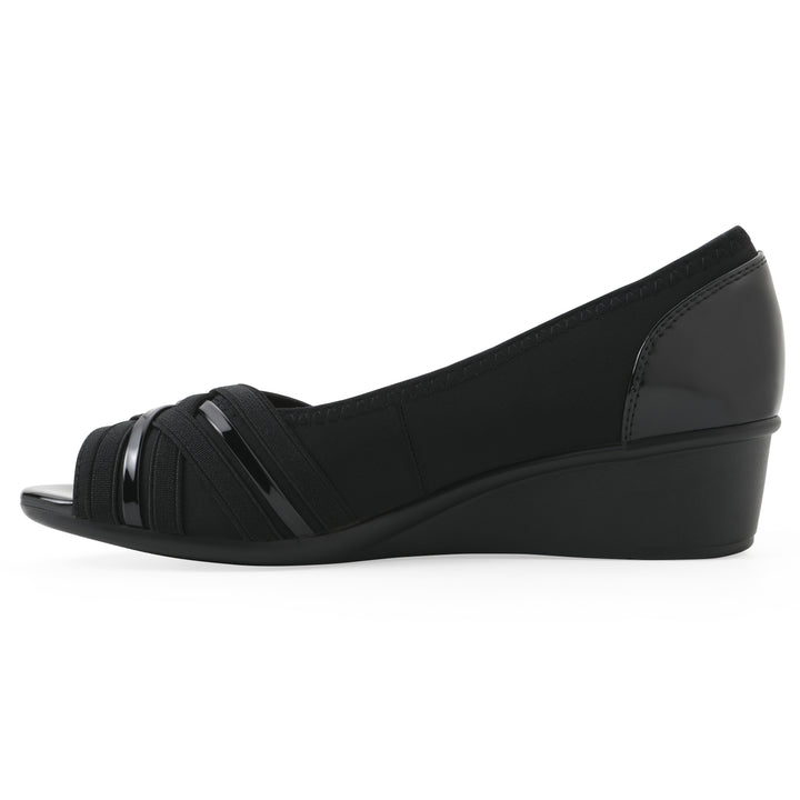 Side view of slip-on black wedge with a peep toe