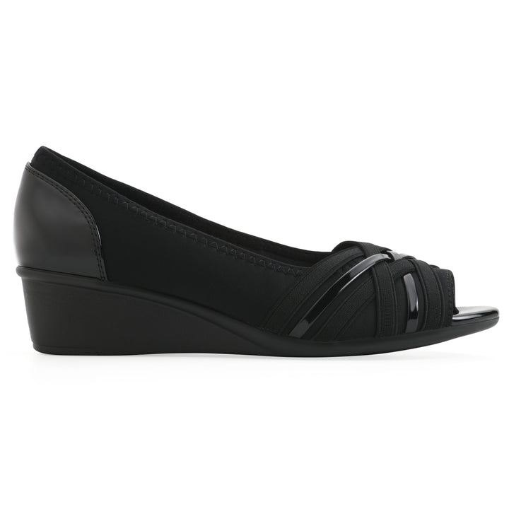 Side view of slip-on black wedge with a peep toe
