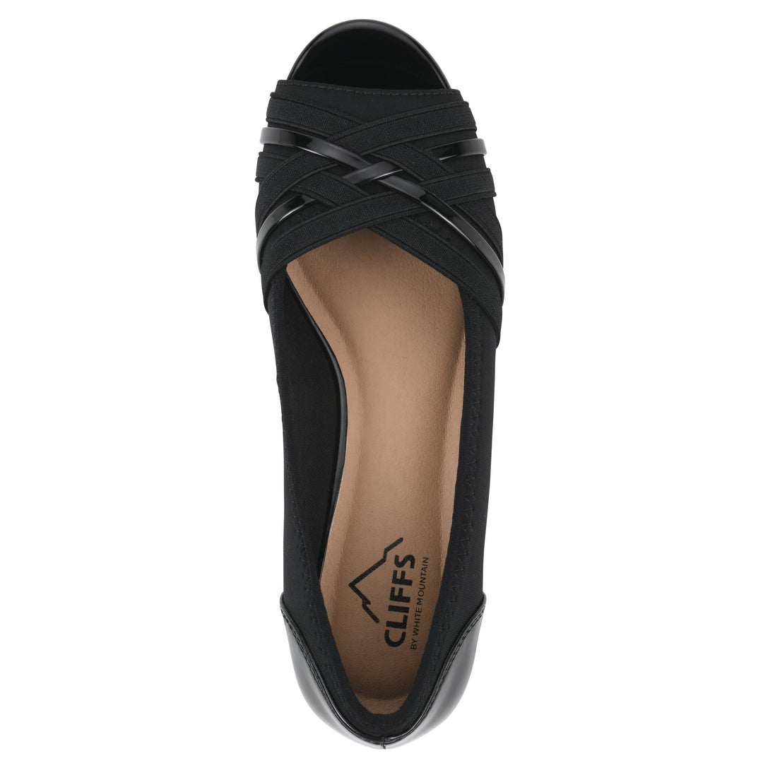 Top view of slip-on black wedge with a peep toe