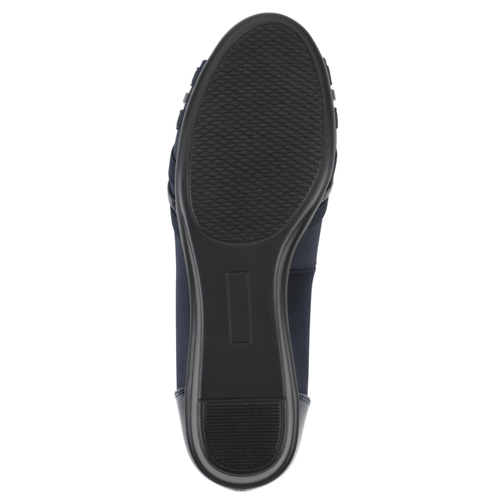 Sole view of slip-on navy wedge with a peep toe