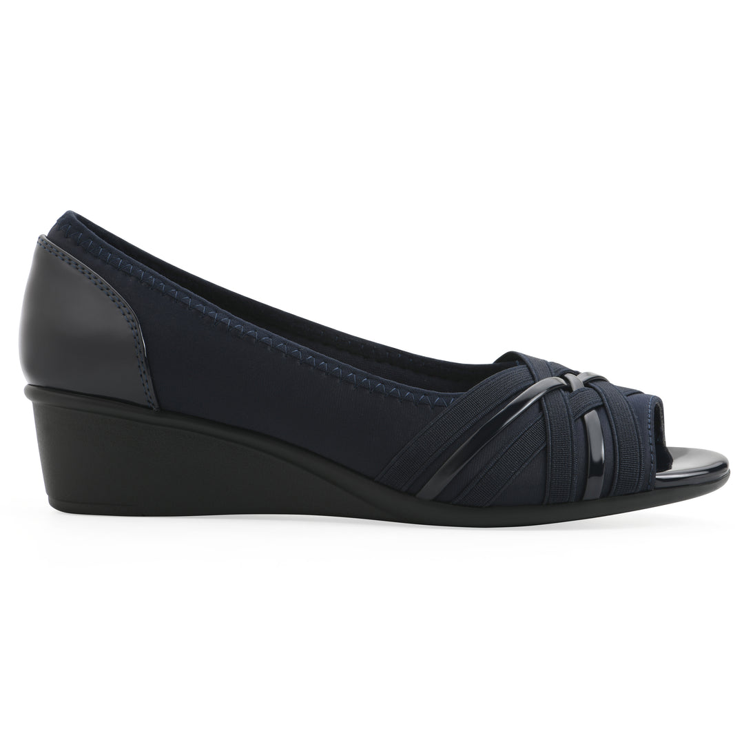 Side view of slip-on navy wedge with a peep toe