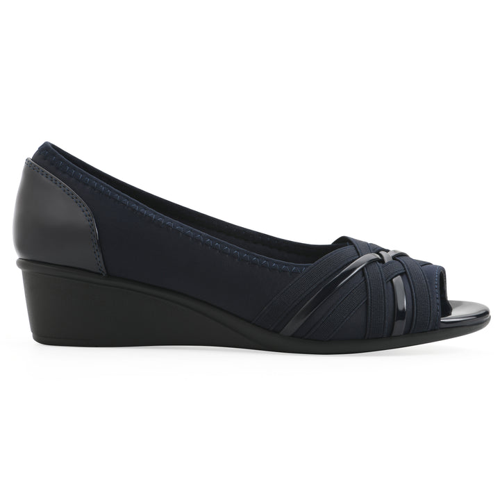 Side view of slip-on navy wedge with a peep toe