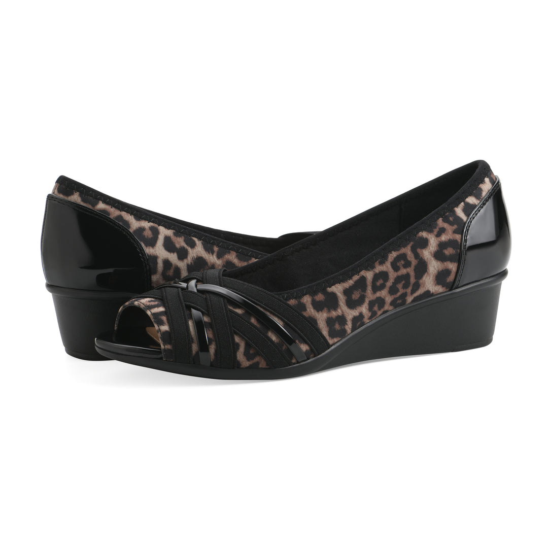 Angle view of a pair of slip-on leopard print wedges with a peep toe