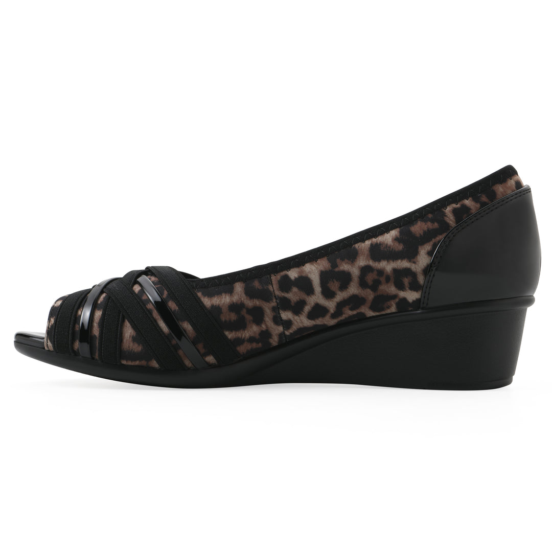 Side view of slip-on leopard print wedge with a peep toe