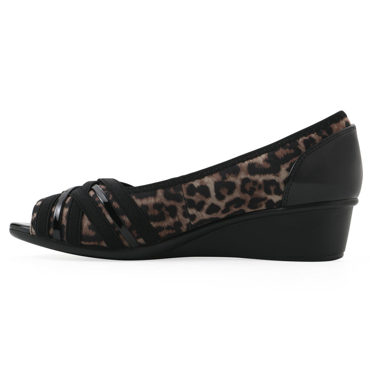 Side view of slip-on leopard print wedge with a peep toe