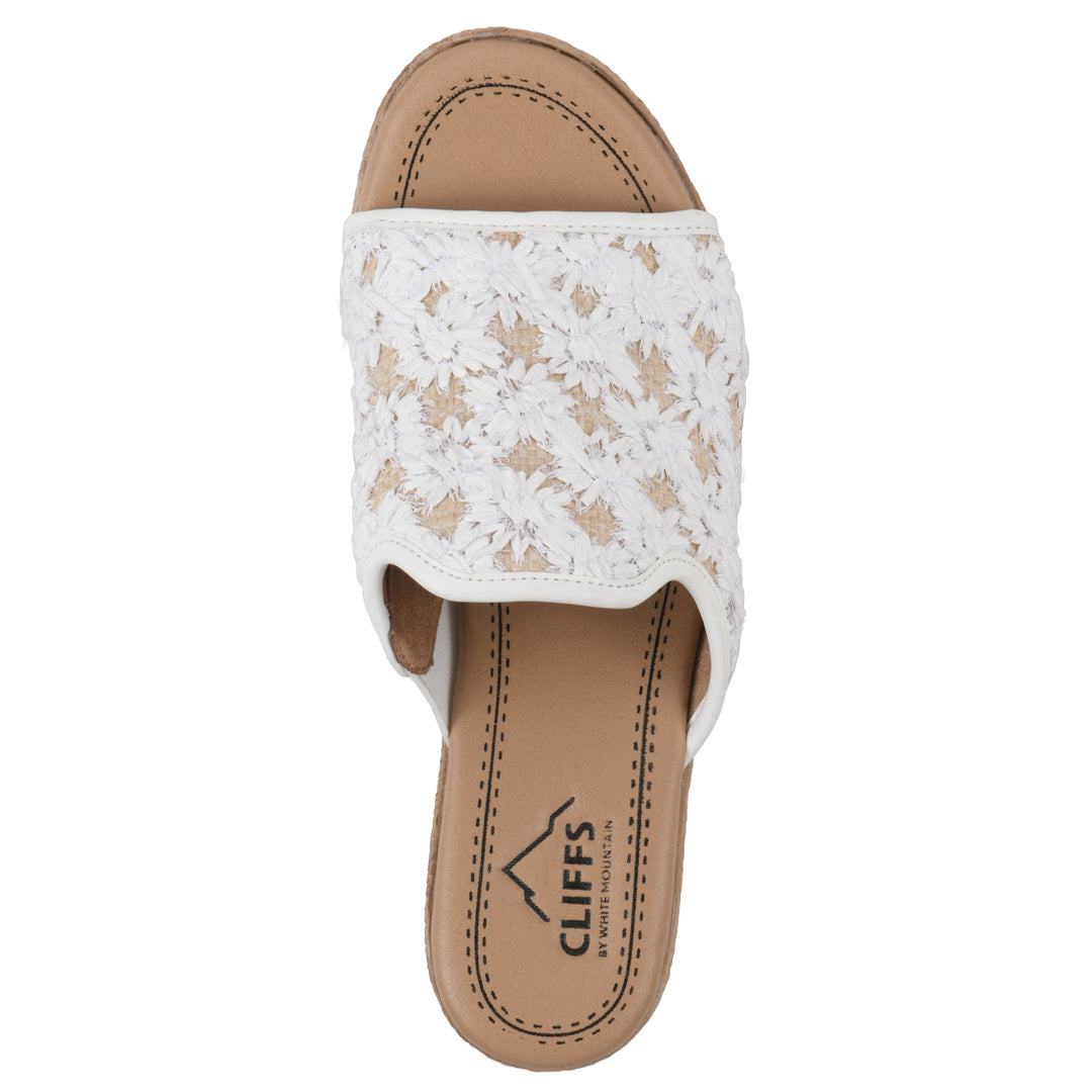 Top view of a white and natural raffia embroidered fabric wedge sandal with a braided rope-style sole