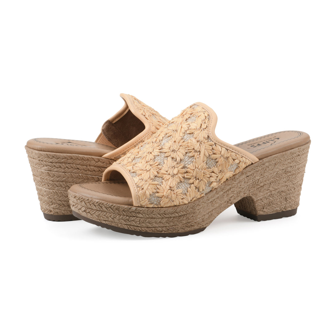 Angle view of a pair of light mustard embroidered fabric wedge sandals with a braided rope-style sole