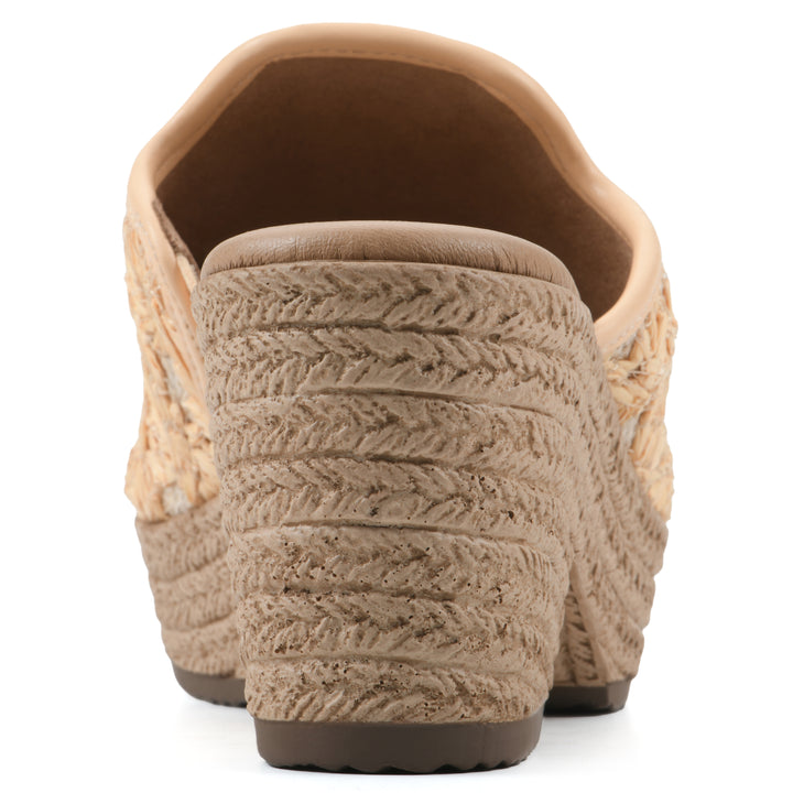 Rear view of a light mustard embroidered fabric wedge sandal with a braided rope-style sole