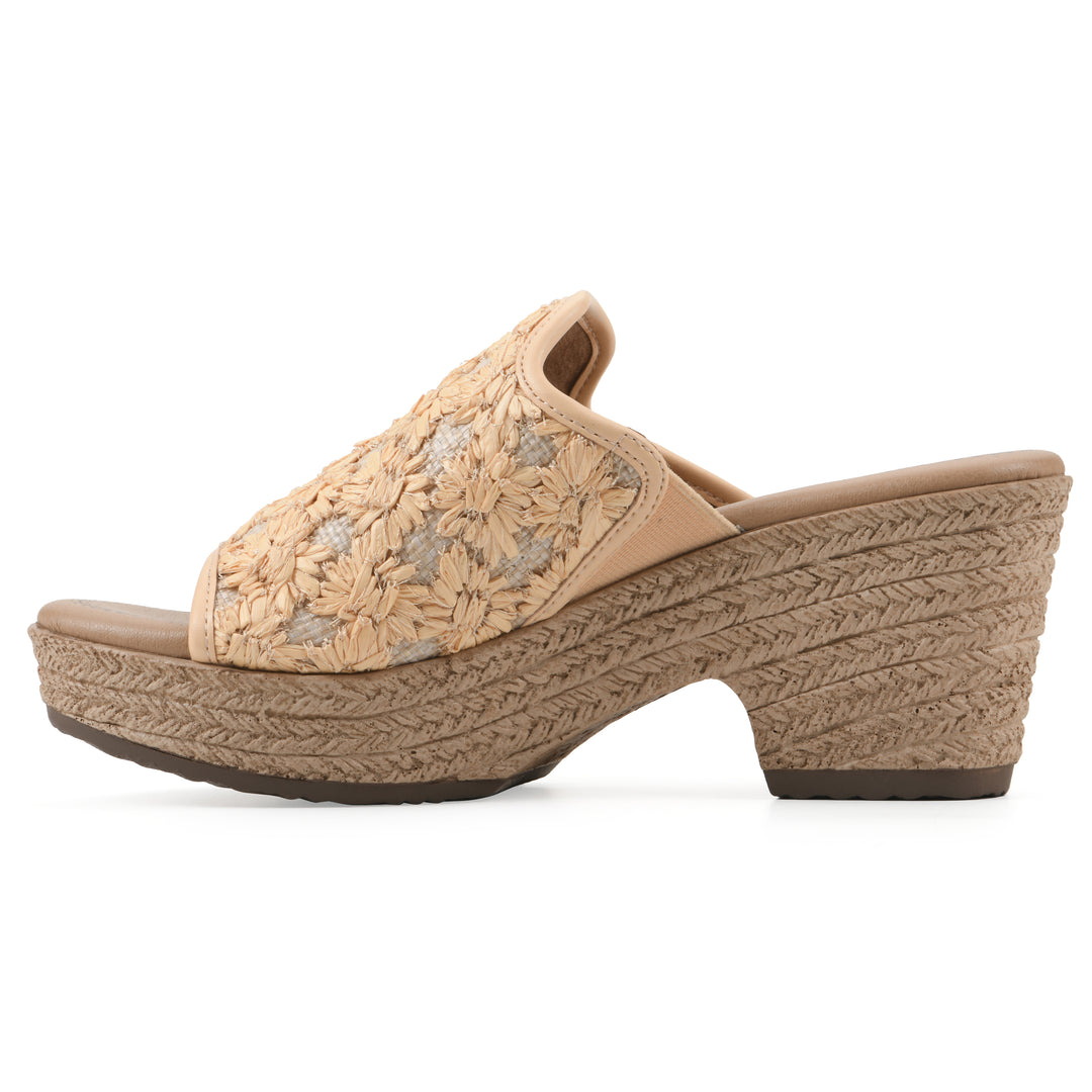 Side view of a light mustard embroidered fabric wedge sandal with a braided rope-style sole