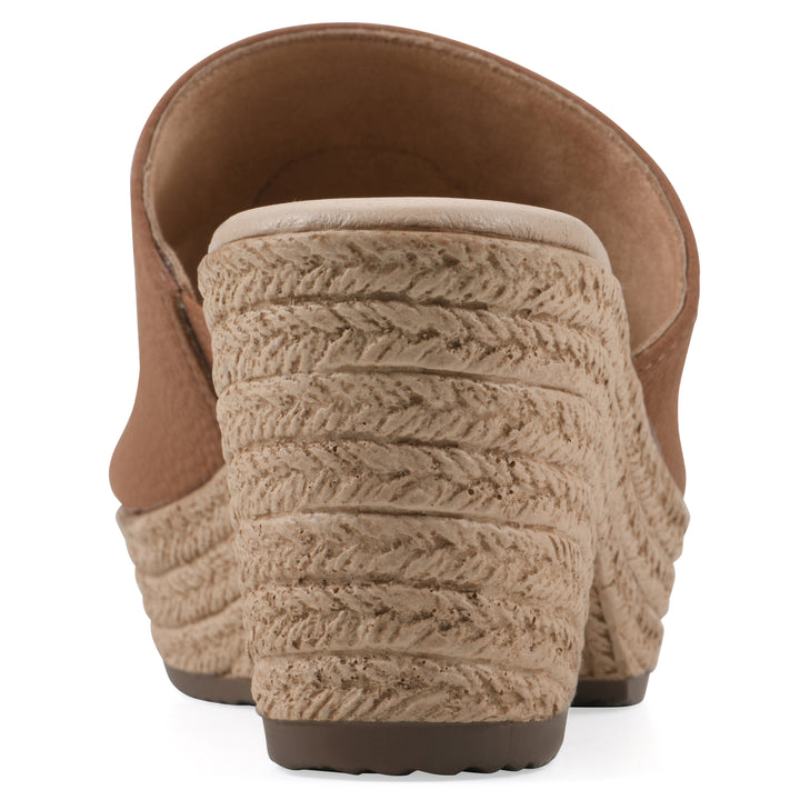 Rear view of a brown, backless wedge sandal with centered sunflower embellishment, and braided rope style heel