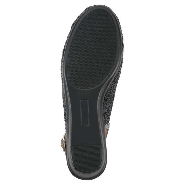 Sole view of a woven, black, raffia slingback with black floral detailing and an adjustable heel strap