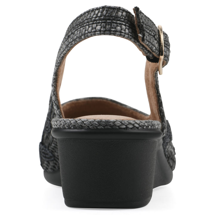 Rear view of a woven, black, raffia slingback with black floral detailing and an adjustable heel strap