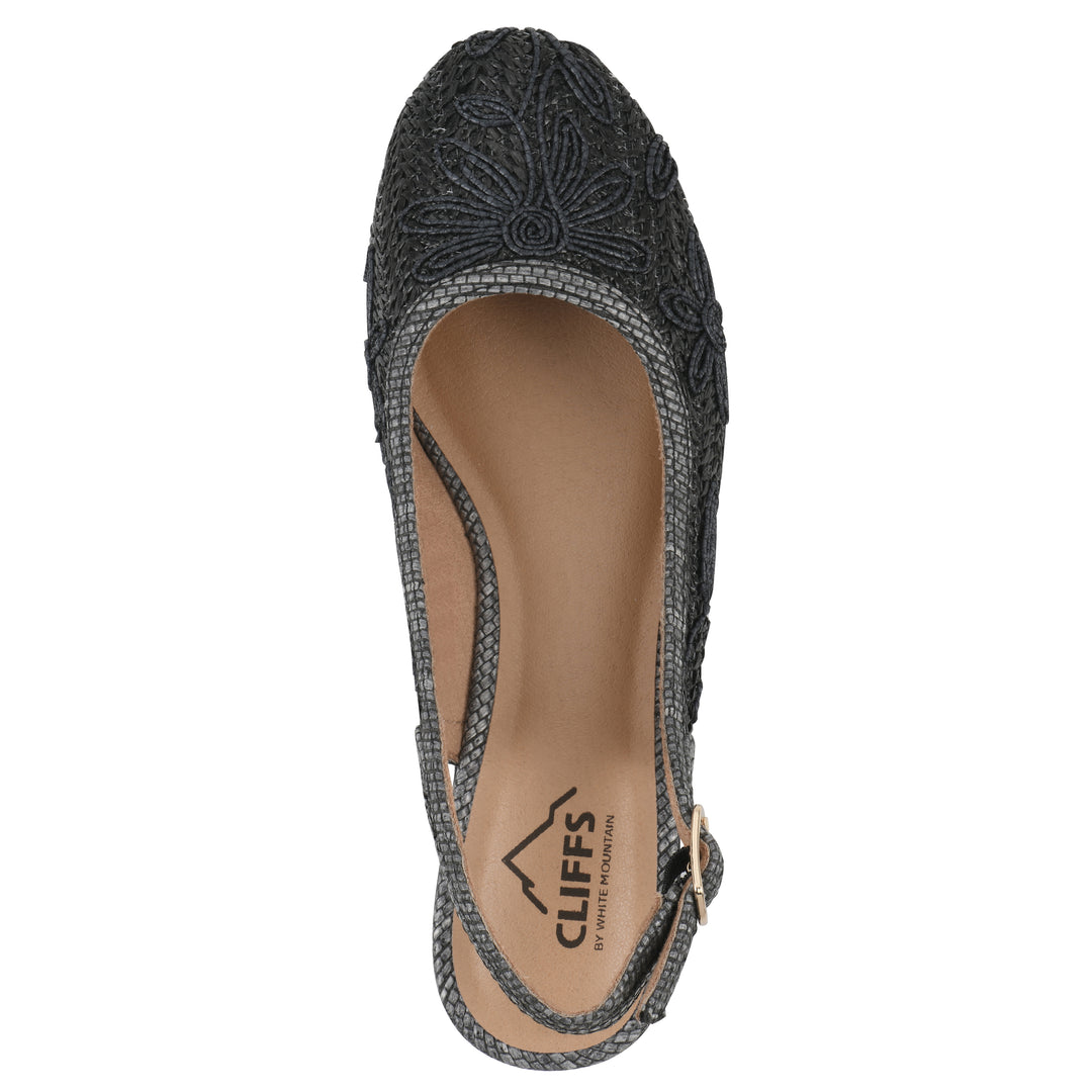 Top view of a woven, black, raffia slingback with black floral detailing and an adjustable heel strap