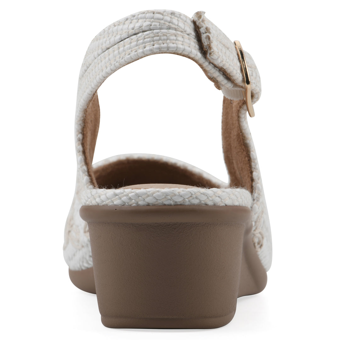 Rear view of a woven, white, raffia slingback with white floral detailing and an adjustable heel strap